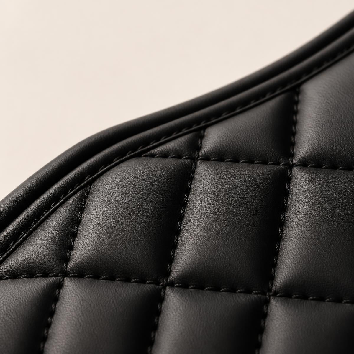 Close detail of the VELORA blanket's black PU leather exterior